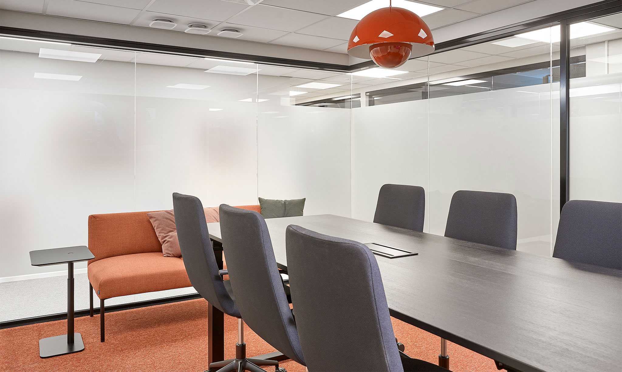 Red Noora sofa and Flowerpot lamp in the conference room