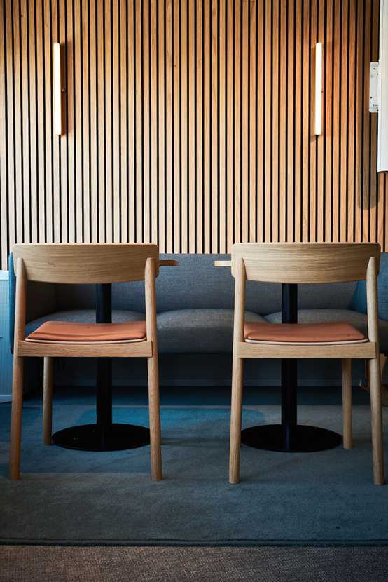 Two wooden chairs from the back